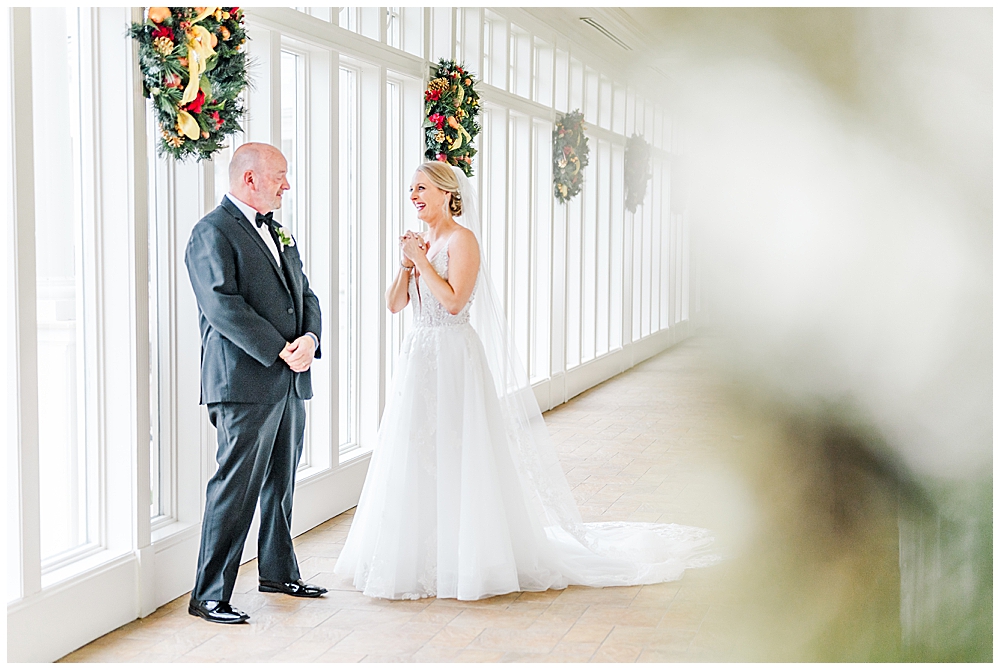 What are the benefits of a second shooter in your wedding photography package? | A second shooter's angle of a First Look between a bride and her dad.
