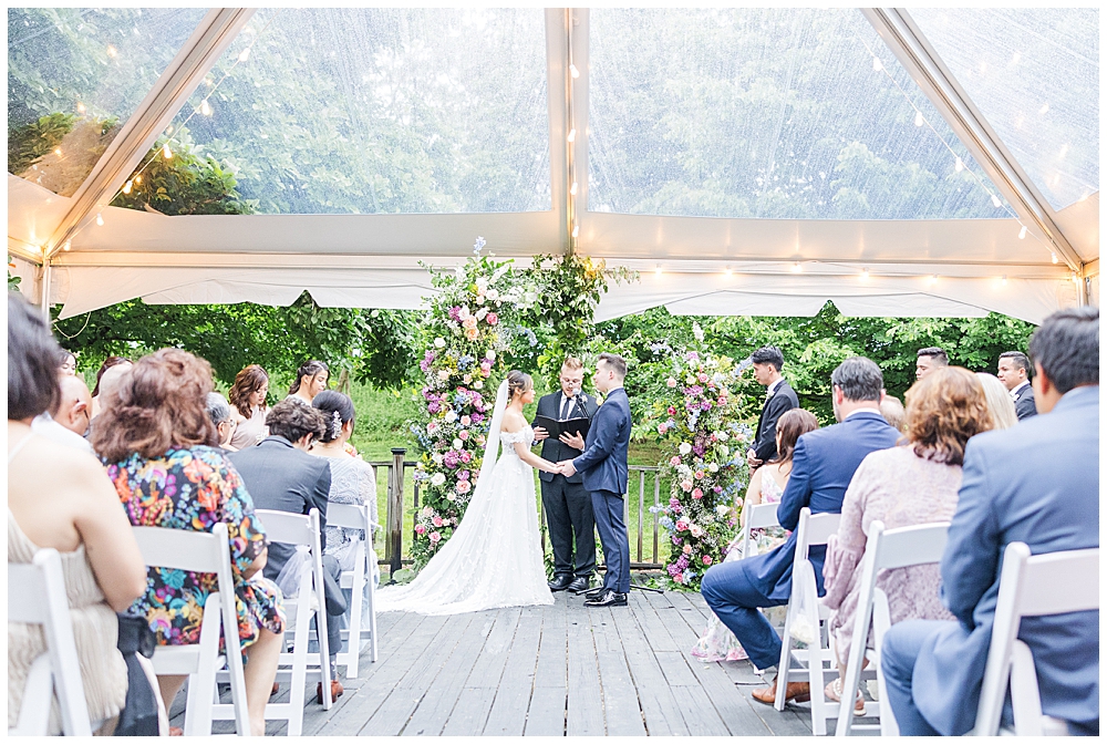 Must-have wedding photos | Atlanta wedding photographer | wide shot of wedding ceremony under a clear-top tent