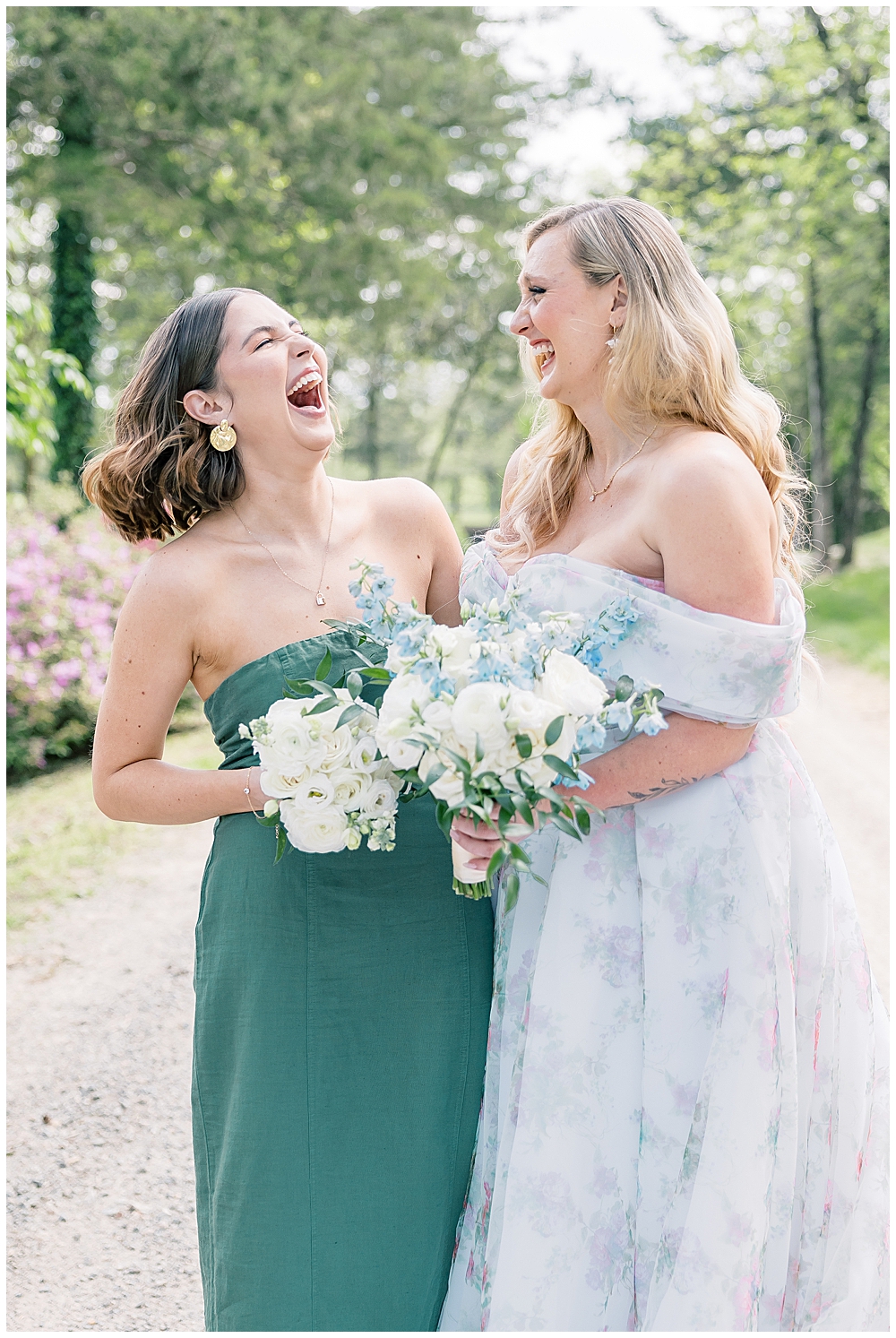 Fine Art Luxury Wedding Photographer in Atlanta | Bride wearing a floral wedding gown and bridesmaid in a green strapless bridesmaid dress laughing together